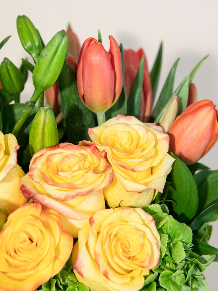 Roses Tulips Lilies Galore! Appropriate for any occasion, but perfect