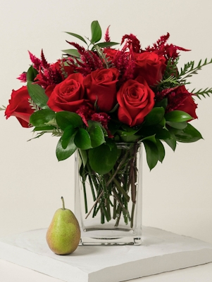 A Heavy Glass Vase of South American Roses